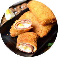 Burger with fried fries on black plate with sauce on the side